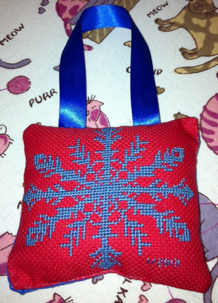 Blue-Snowflake-Cross-Stitched-on-Red-by-Angela